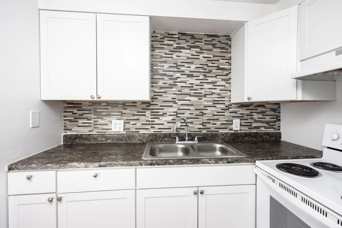 Newly tiled back splash and double sink in kitchen! - 1901B SW 40th Ter