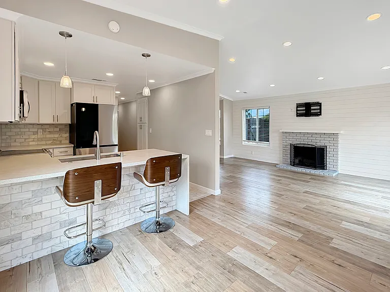 Dining To Breakfast Bar And Living Room View