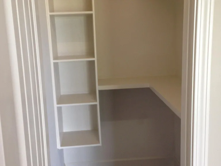 Closet with custom wood shelving.