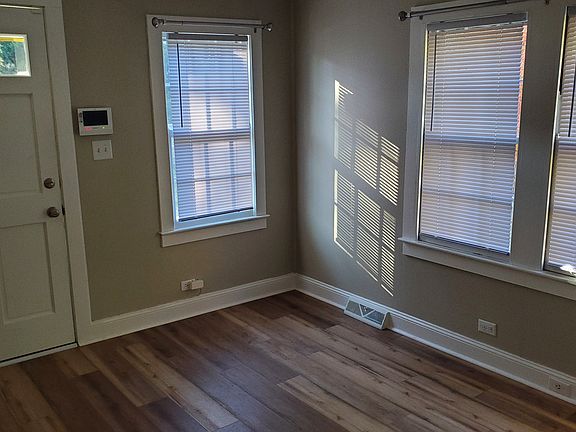 Living room with alarm panel at entrance