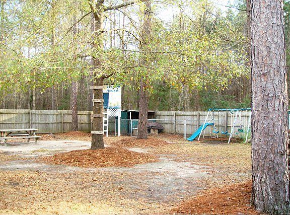 Large fully fenced-in back yard with patio and wide gate for easy access!