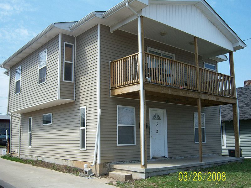 Front view with driveway into the huge parking lot!