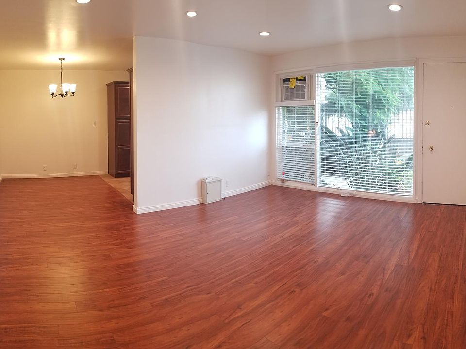 BEAUTIFUL HARDWOOD FLOORS WHILE ENTERING A LARGE LIVING AREA!