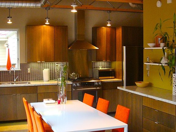 Kitchen features large dining area, custom cabinetry made of rift-sawn oak