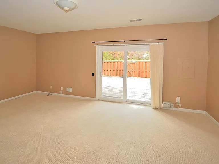 Family/recreation room with access to wooden patio
