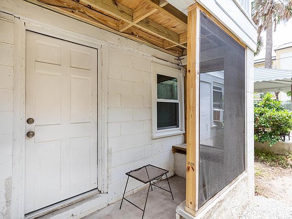 Covered porch for kitchen entry.