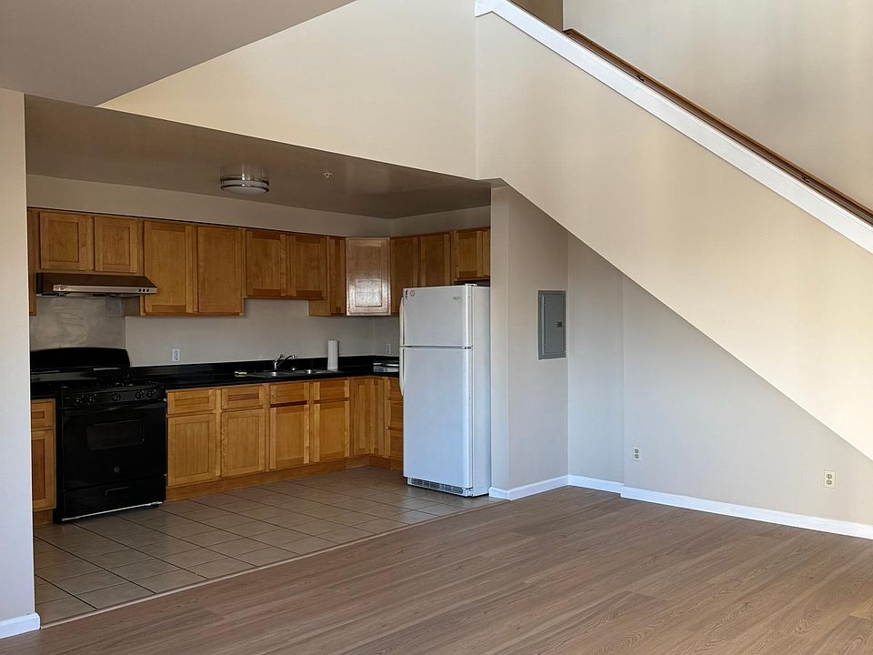 view of kitchen and stair to second level