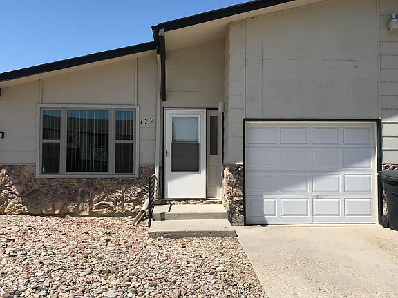Walk into living room from garage. Has remote opener.