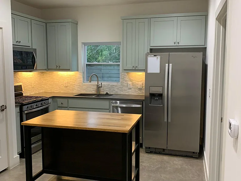 Modern appliances, backsplash and butcher block island
