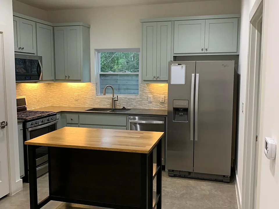 Modern appliances, backsplash and butcher block island