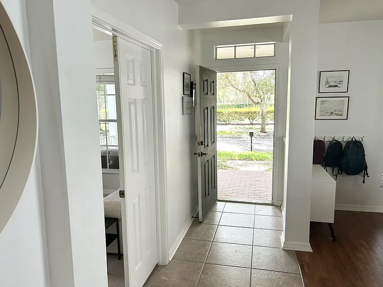 After going past the dining room and office you come to the stairs where the entrance to the foyer is. Laundry and half bath.