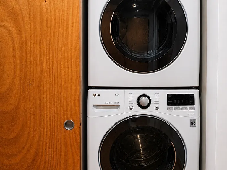 Full size stackable washer and dryer in unit