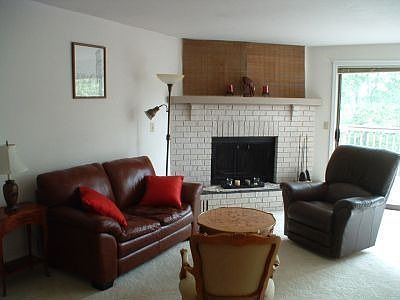 The living room has direct access to a large deck which faces West and takes advantage of the aftern