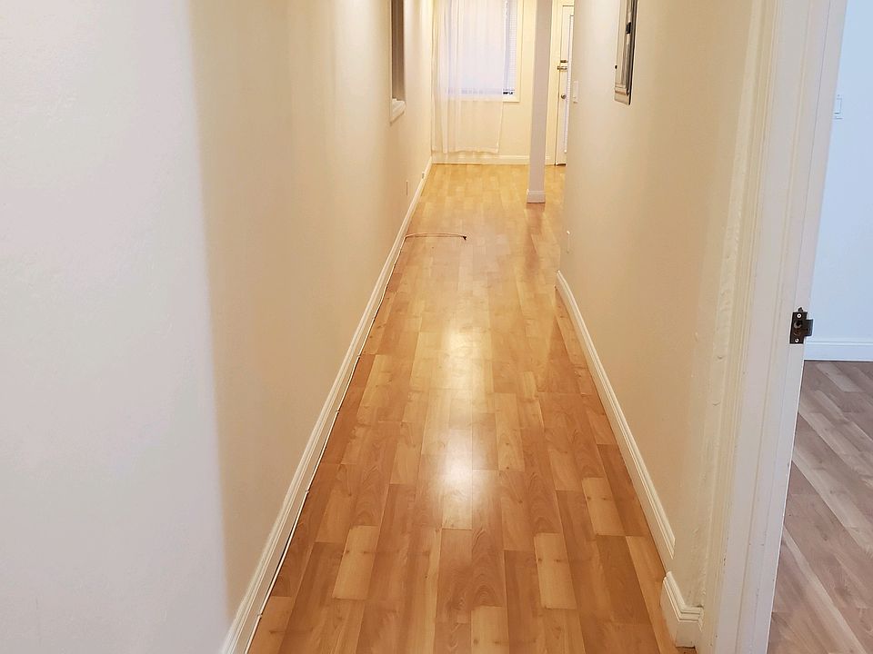 The first thing you see when you open the front door - the long hallway. Bedroom is to the immediate right.