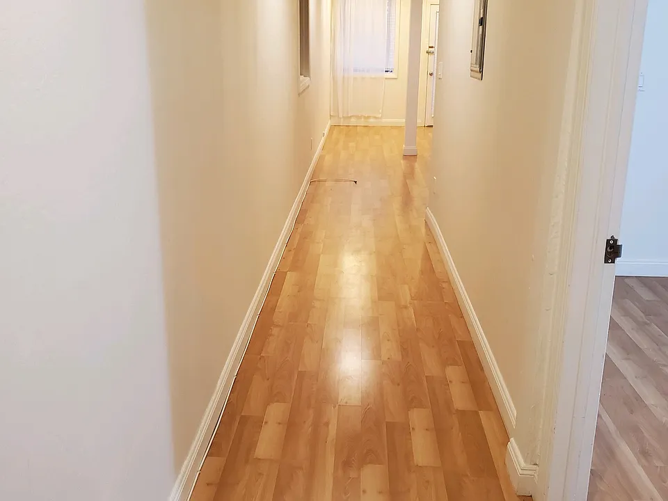 The first thing you see when you open the front door - the long hallway. Bedroom is to the immediate right.