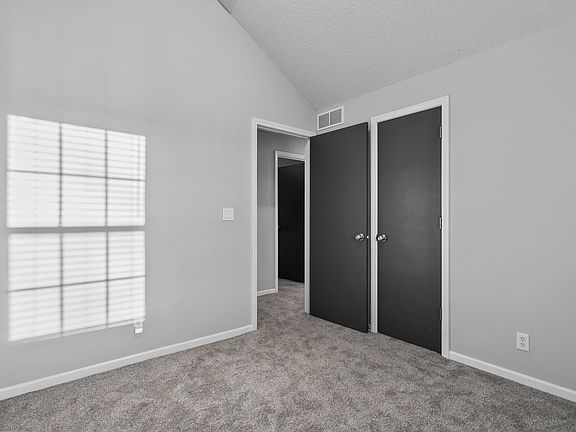 Upstairs bedroom at end of hallway.