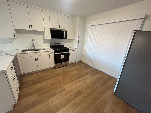 Kitchen with all appliances(stove, refrigerator, microwave and dishwasher)