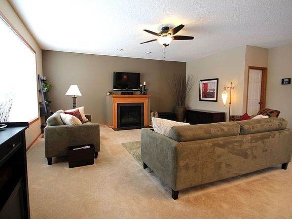 Very spacious family room has a cozy gas fireplace & large windows.