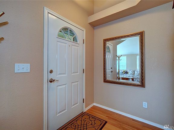 Interior front entrance/foyer has a convenient coat closet for shoes and coats. 
