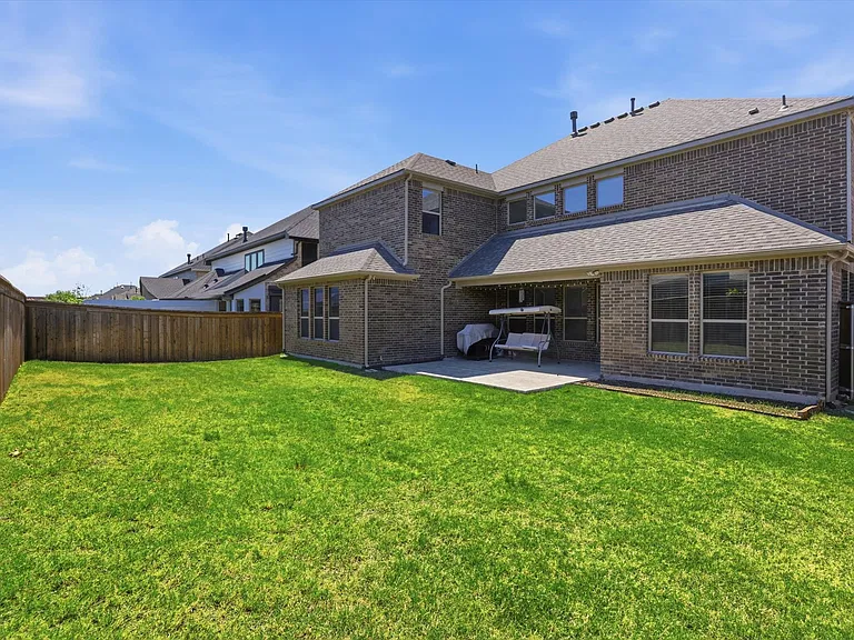 Large backyard with extended patio