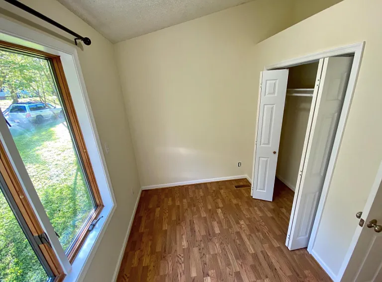 2nd bedroom with full size closet, and a beautiful window!