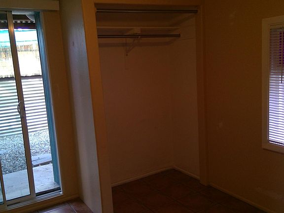 Bedroom with slider to fenced backyard and 4 ft wide closet.