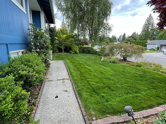 Walk way to front door, upper front lawn