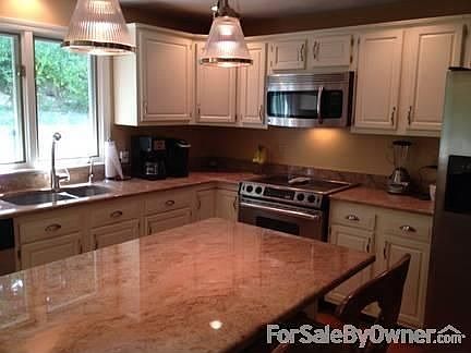 Kitchen
						:
						Granite Counters-Stainless Steel Appliances-Disposal
City water and sewer