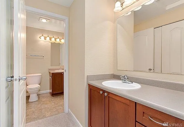 Additional sink in the hallway from master bedroom to bathroom just across the in-closet washer & dryer
