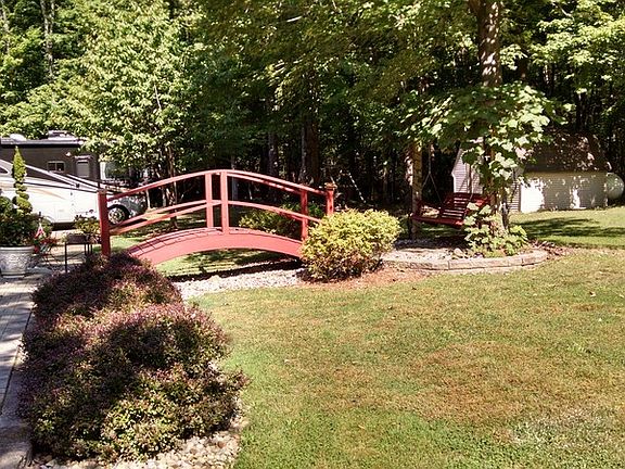 Bridge and grape arbor with swing