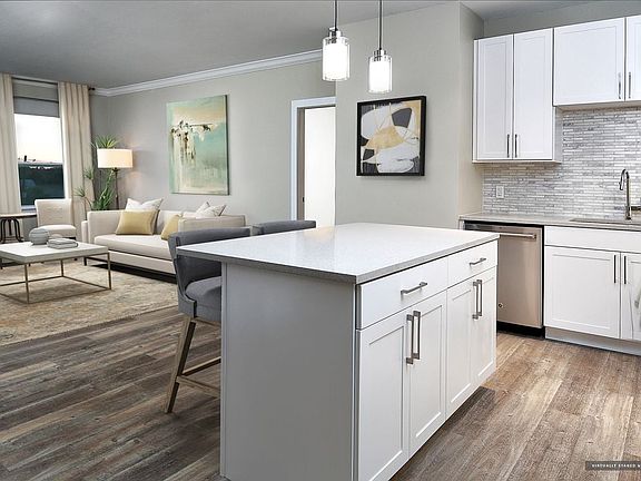 Signature Collection kitchen and living room with hard surface flooring