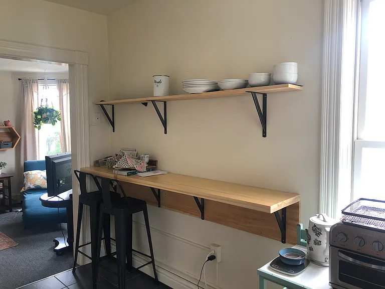 View of kitchen and into living room.