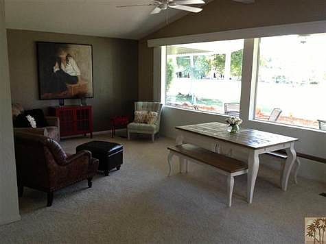 Living ROOM WITH PICTURE WINDOWS OVER LOOKING GOLF COURES