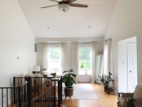 Living Room and Spiral Staircase leading downstairs.