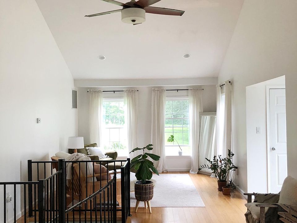 Living Room and Spiral Staircase leading downstairs.