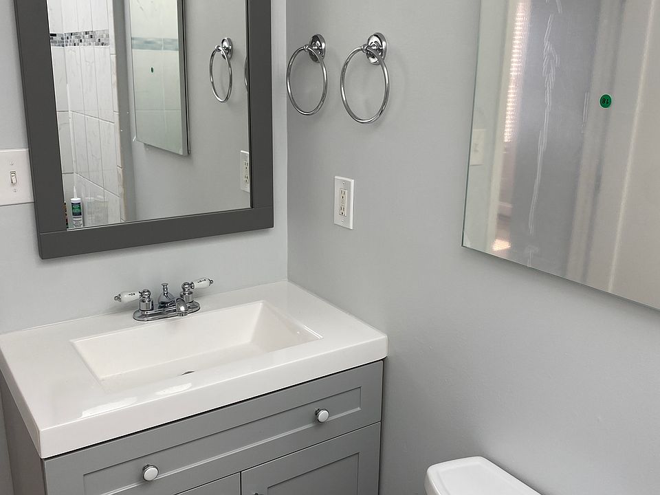 bathroom with new vanity, sink, fixtures, hardware, and mirror/medicine cabinet
