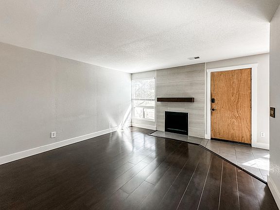 Living room, fireplace is decommissioned and not usable