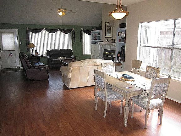 Spacious main living/dining area with recent laminate wood flooring throughout this area, the kitchen area and there is also brand new carpeting in the two bedroom areas downstairs as well.