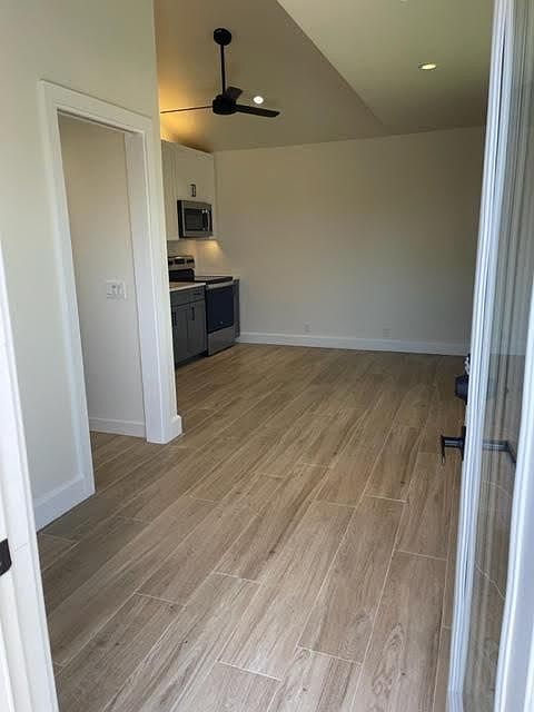 View into studio from front door; tile floor that looks like wood