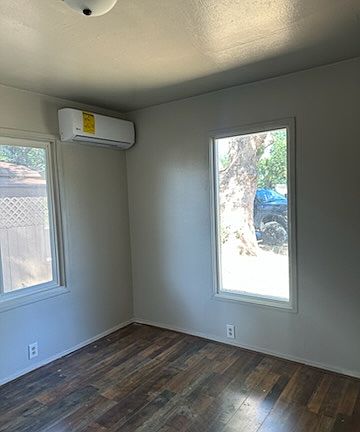 This is the front bedroom with closet and mini split heat & air conditioning unit