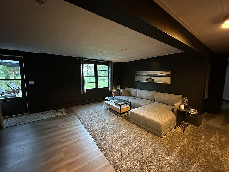 Downstairs landing pad offers walk way to backyard and space for entertaining.