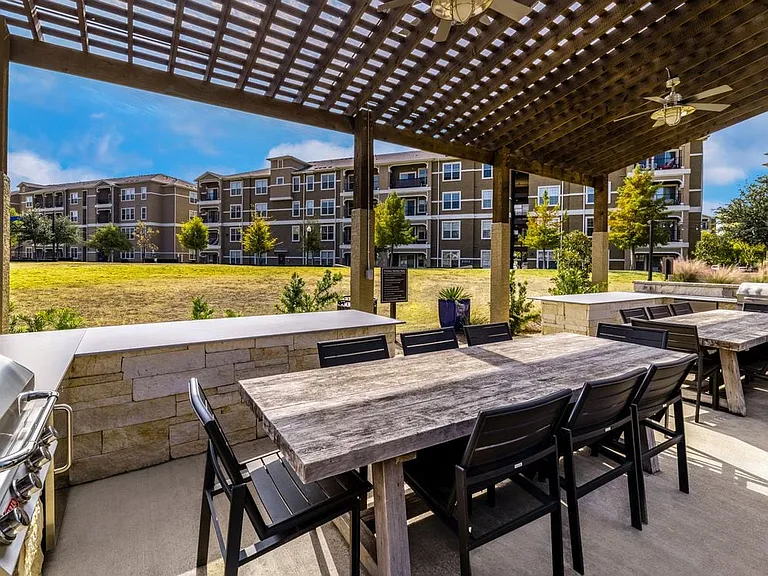 Courtyard with grill stations and dining areas
