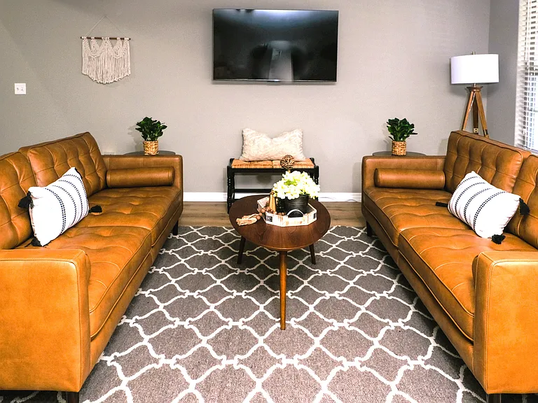 Living room with lots of seating. 55 inch smart TV