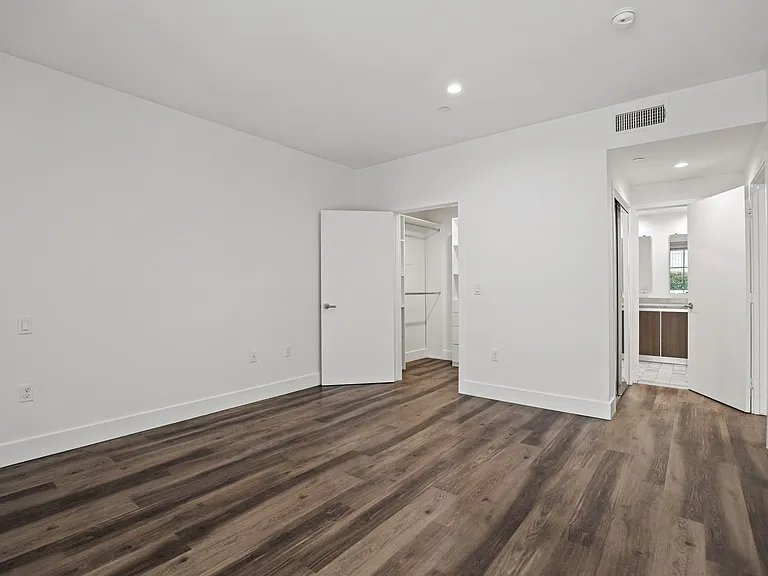 Bedroom with Closet, Bathroom, Recessed Lighting, and Vinyl Lighting