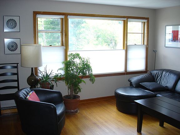 Living Room Lots of daylight large front window with winter view of downtown. 