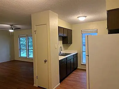 Facing living room and kitchen from dining area