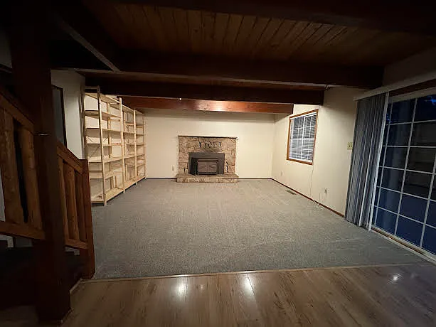 Livingroom with slider to deck over-looking forest
