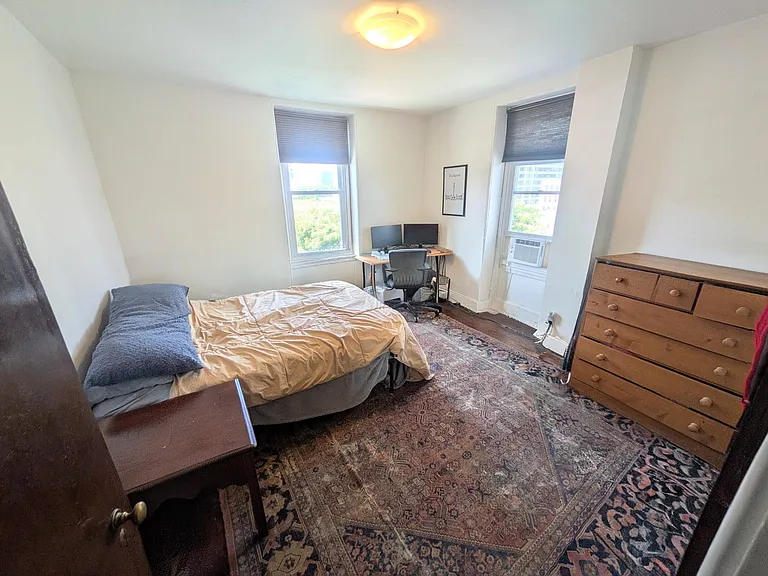Large quiet bedroom with tons of natural light, newly refinished wood floors, and a fantastic view of the city skyline!