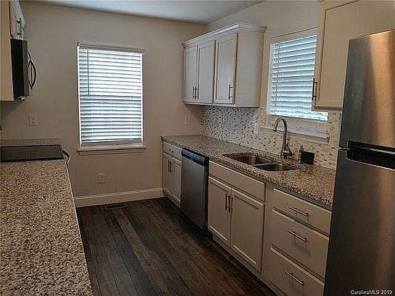 Kitchen (its even better in person). The granite is beautiful with backslash, and stainless steel appliances (appliances include refrigerator, dishwasher, garbage disposal, oven and microwave)