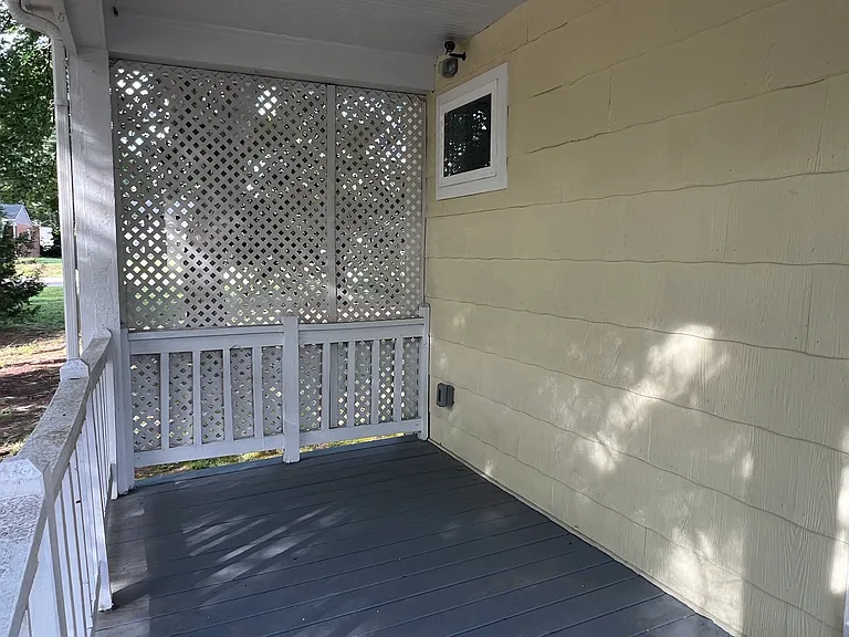 smaller covered side porch (east side)